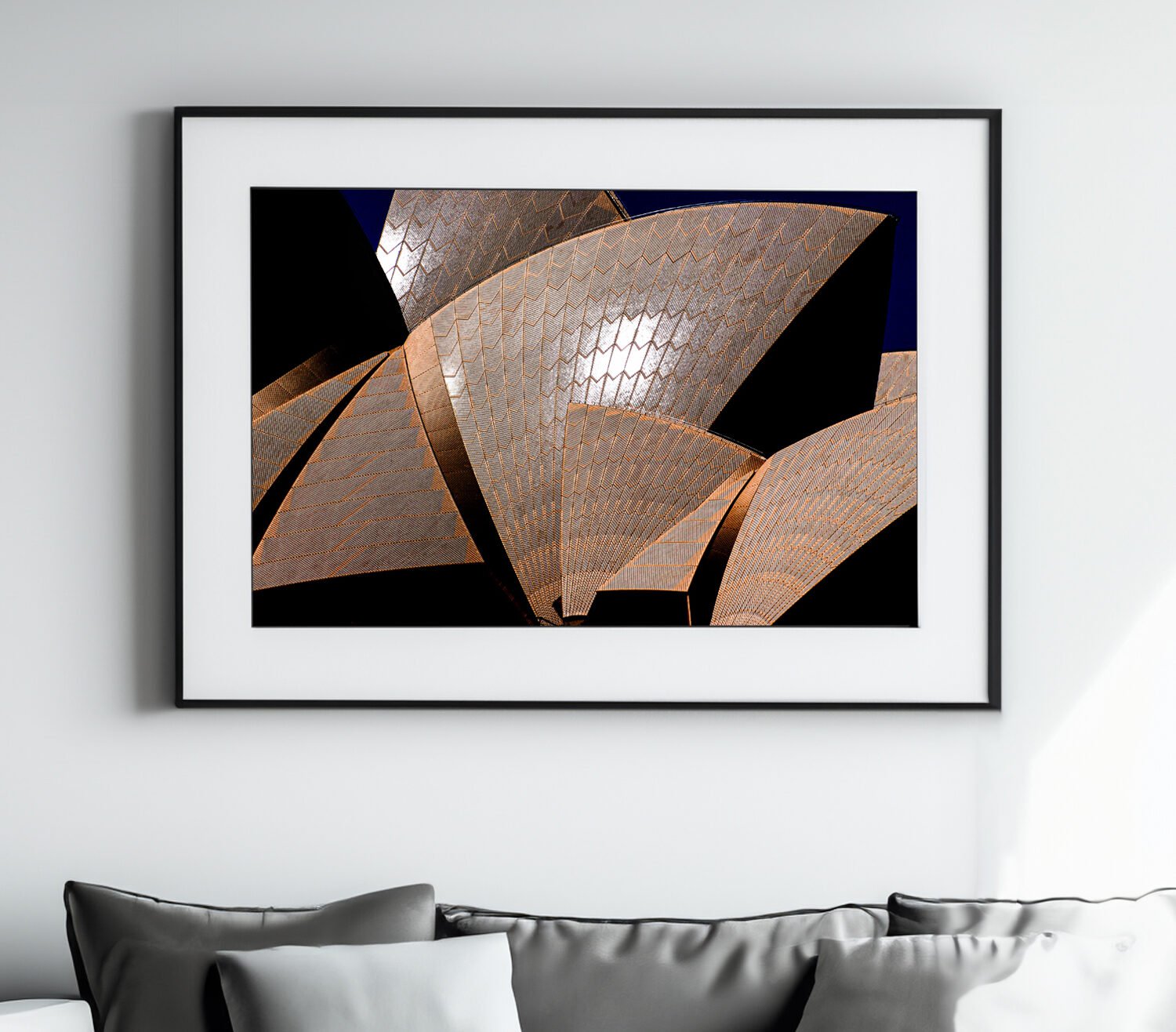 Close-up of the sydney opera house shells with intricate tile patterns against a blue sky.